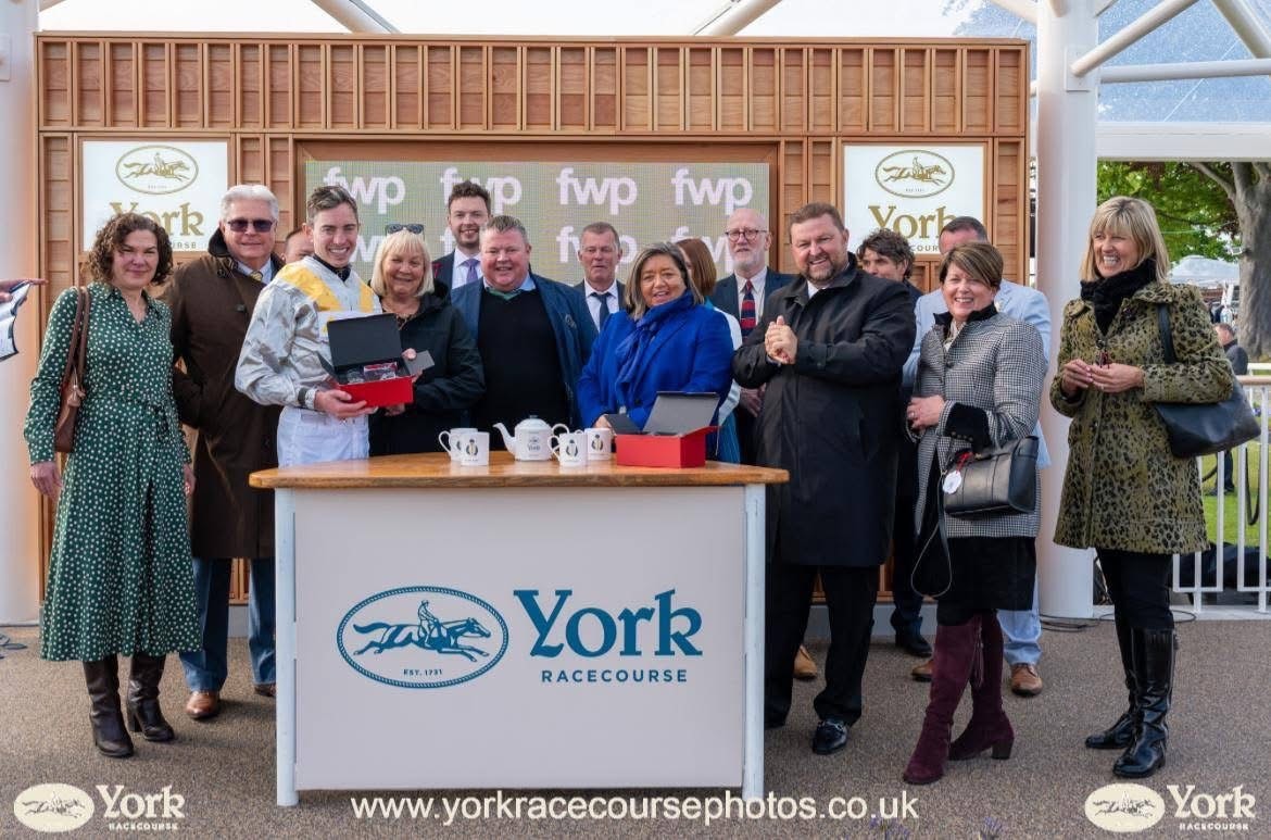 Gee Gees Racing syndicate members celebrating at York Racecourse